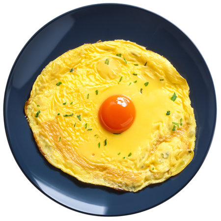 Omelette with egg and herbs on dark blue plate. Isolated over white background top viewの写真素材