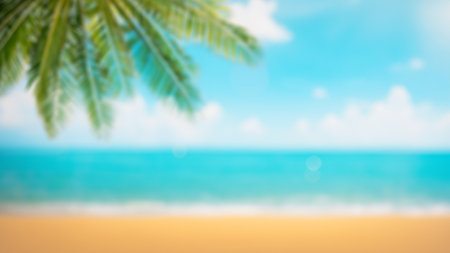 Abstract stylish photography seascape with palm tree, tropical beach background. blur bokeh light of calm sea and sky. summer vacation background concept with copy spaceの写真素材