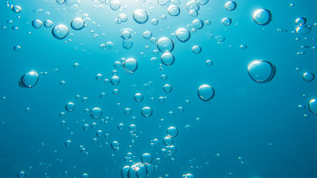 Bubbles Underwater Background in Clear Blue Oceanの写真素材