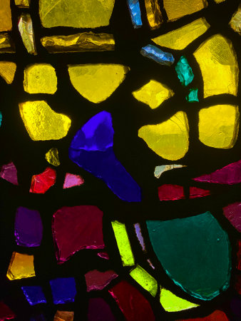 Close-Up of Colorful Stained Glass Window with Vibrant Fragmentsの写真素材