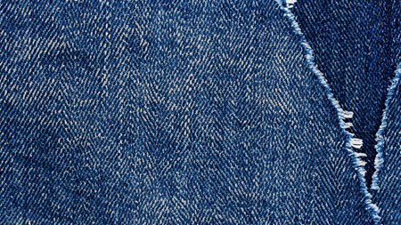 High Detail Ripped Denim Jeans Texture Backgroundの写真素材