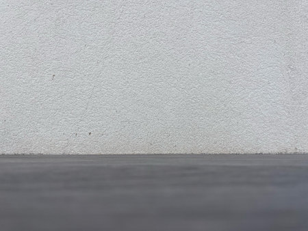 Neutral Minimalist Textured Empty White Wall and Dark Concrete Floor Background for Mockupの写真素材