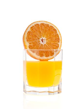 Glass of orange juice, and orange on white backgroundの写真素材