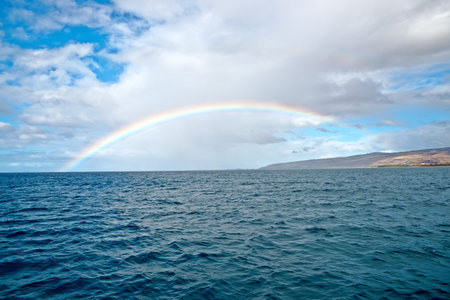 Beautiful rainbow in Hawaii, Pacific ocean. shoreline of Kauai Islandの写真素材