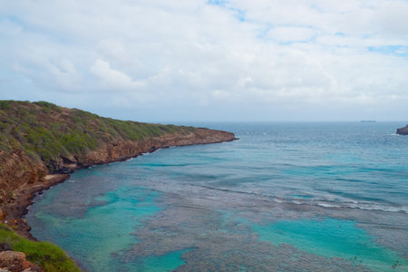 View of Hanauma Bay, Oahu, Hawaii. Hanauma Bay is formed within a volcanic cone and located along the southeast coast of the Island of Oahu. It is a protected marine life conservation area and the best snorkeling spot on the island.の写真素材