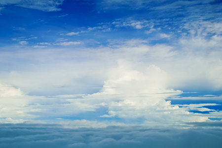 Flying above clouds, blue sky and clouds panorama