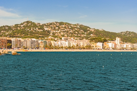 Lloret de Mar, Spain - October 13  Tourists enjoy beach in Lloret de Mar on Costa Brava shores on October 13, 2013のeditorial素材