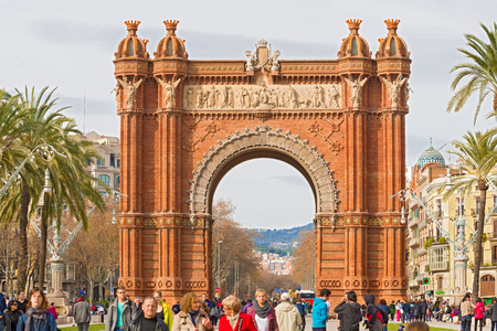 Barcelona, Spain - January 26, 2014  The Arc de Triumph in Barcelona, Spain was build in 1888 for Universal Exposition  The Arch served as  its archway to the exhibition  People walking by on a sunny day in January 26, 2014のeditorial素材