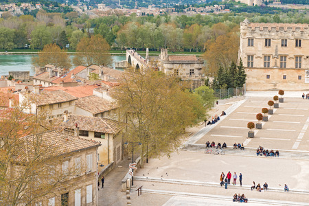 Avignon, France - March 29, 2012  Tourists in front of Popes Palace in Avignon France on March 29, 2014  Avignon bridge at the backgroundのeditorial素材