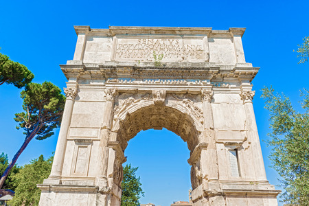 The Arch of Titus is a 1st-century honorific arch, located on the Via Sacra, Rome, just to the south-east of the Roman Forumの写真素材