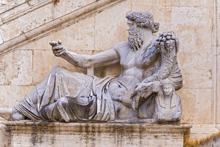 Sculpture of Ancient Roman allegory of Nile River. statue in front of stairs into Palazzo Senatorio  on left side. It is located in Piazza del Campidoglio, Rome, Italy.のeditorial素材