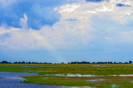 Sun above clouds at Chobe river in Botswanaの写真素材