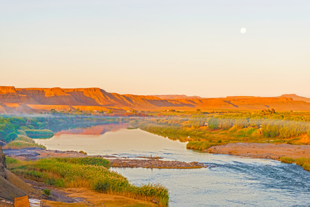Scenic sunset view at the Orange river in Noordoewer in Namibia at Felix Unite Camp on May 2, 2015の写真素材
