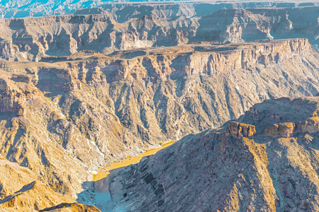 The Fish River Canyon is located in the south of Namibia. It is the largest canyon in Africa. It features a gigantic ravine, in total about 160 km  long, up to 27 km wide and in places almost 550 meters deep.の写真素材