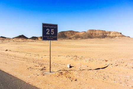 Sign on the road to Wadi Halfa, showing the number of kilometers to the border with Sudan.