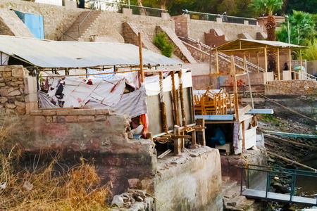 Constructed houses on river Nile bank in Aswan in Egyptのeditorial素材