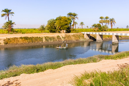 Nile, Egypt - January 14, 2015: Fisherman on the channel of the Nile river.のeditorial素材