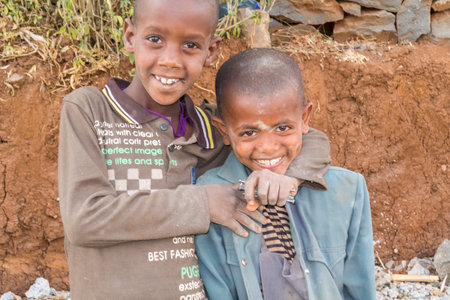 Debre Markos, Ethiopia - February 14, 2015: Close up picture of the two young boys staying by the...
