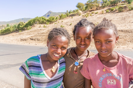 Addis Zemen, Ethiopia - February 10, 2015: Close up picture of the children coming back from school. Picture was taken on the road near Addis Zemen in Ethiopia.のeditorial素材