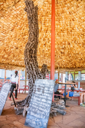 Ngorongoro, Tanzania - March 13, 2015: Carved pillar supports roof in the restaurant in Ngorongoro park in Tanzaniaのeditorial素材
