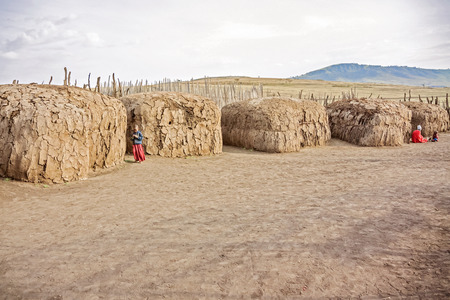 Serengeti, Tanzania - March 12, 2015: View at the houses in Masai village in Tanzania near Serengeti National Park on March 12, 2015.のeditorial素材
