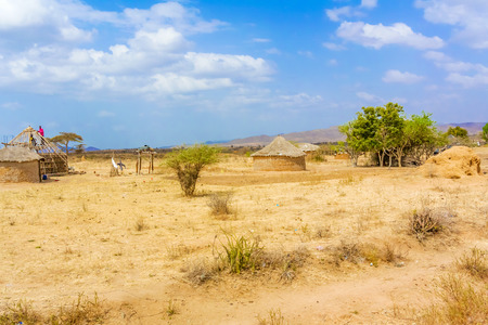 Moyale, Ethiopia - February 27, 2015: Farmland landscape and the people building the houses. Picture was taken from the road 80 near Moyale in Ethiopia.のeditorial素材