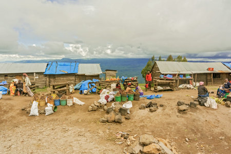 Mbeya, Tanzania - March 20, 2015: People selling crops at small village near Mbeya in Tanzaniaのeditorial素材