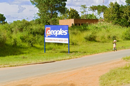Mzuzu, Malawi - March 25, 2015: View at the road welcome sign to Mzuzu in Malawiのeditorial素材