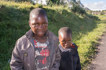 Mbeya, Tanzania - March 22, 2015: Picture of the young boys  in a small village near Mbeya in Tanzania.のeditorial素材