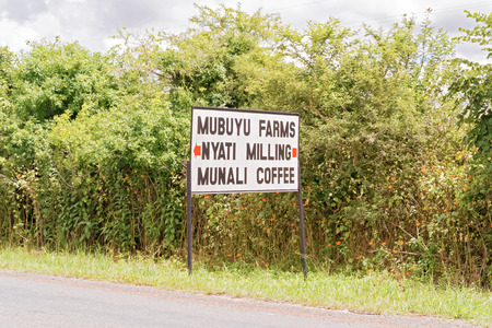 Lusaka, Zambia - April 5, 2015: Sign at the road pointing direction to Munali coffee farm, Nyati Milling and Mubuyu farms near Lusaka in Zambia.のeditorial素材