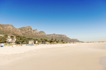 Cape Town, South Africa - May 12, 2015: People are resting on the sandy  beach in Cape Town, South Africaのeditorial素材