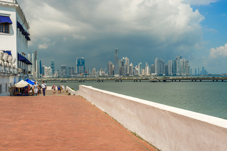 Panama city, Panama - November 23, 2015: People walking in old part of Panama city and the skyscrapers skyline at the backgroundのeditorial素材