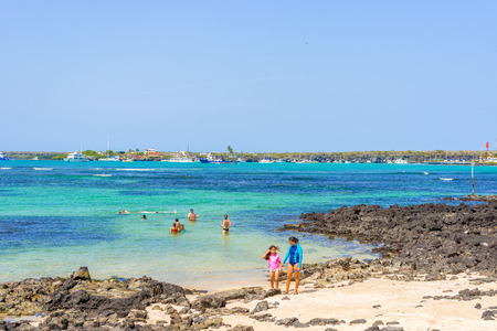 Puerto Ayora, Galapagos, Ecuador - April 5, 2016: People in the water taxi at the bay at Puerto Ayora on Santa Cruz Island in Galapagos.のeditorial素材