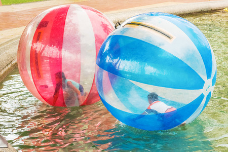 Guayaquil, Ecuador - April 15, 2016: Children playing in the ball and swimming in the pond in the park area in Malecon 2000 in Guayaquil in Ecuador.のeditorial素材
