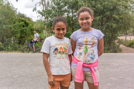 Valle Valerio, Nicaragua - November 23, 2016: Two young teenage girls standing at the road in small village of Valle Valerio in Nicaragua.のeditorial素材