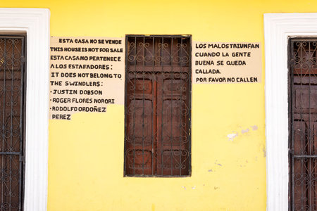 Granada, Nicaragua - November 20, 2016: Street view at the entrance door and window of colorful house in the historic district of Granada in Nicaraguaのeditorial素材