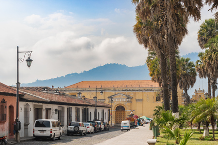 Antigua, Guatemala - December 6, 2016: Park and cobblestone street and Convento Santa Clara at the background in Antigua, Guatemala.のeditorial素材