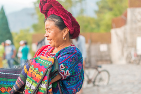 Panajachel, Guatemala - December 7, 2016: Portrait of the woman selling goods on the street of touristic town of Panajachel in Guatemala.のeditorial素材