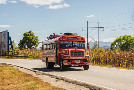 Chinique, Guatemala - December 9, 2016: Colorful bus on the road in the highlands of Guatemala. near town of Chinique.のeditorial素材