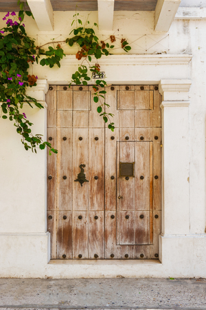 Cartagena, Colombia - March 26, 2017: View at colonial entrance door with knocker in old historic part of Cartagena, Colombiaのeditorial素材