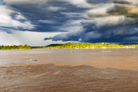 Cloudy sky over the Mekong river in Muang Khong in Laos.の写真素材