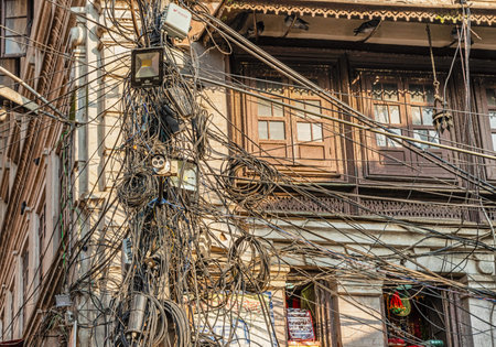 View at the post holding all types of cables located in the street in Thamel, Kathmandu, Nepal.