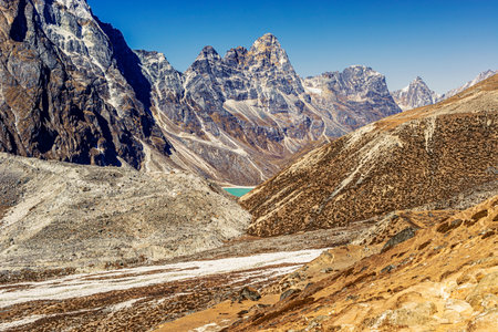View at the scenic valley and Himalayan mountains peaks on the Everest Base Camp trek between Tengboche and Lobuche, Nepal.の写真素材
