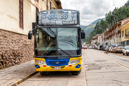 Cusco, Peru - April 3, 2019: City tour  double decker Sightseeing Bus for the tour around city of Cusco waiting for tourists on the street in Cusco, Peru.の写真素材