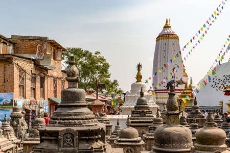 Kathmandu, Nepal - Oct 11, 2018: Tourists visiting temples complex Harati Ajima Temple, Dongchu monastery located on the hill at Swayambhunath Stupa and overlooking city of Kathmandu in Nepal.のeditorial素材