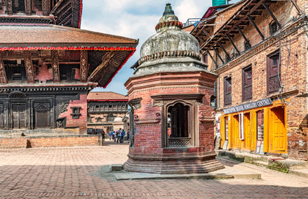 Bhaktapur, Nepal - Oct 12, 2018: Tourists visiting Bhaktapur Durbar Square in Nepal, the 55 Window Palace at at the background.のeditorial素材