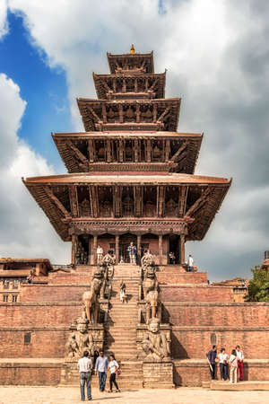 Bhaktapur, Nepal â October 12 2018: Tourists admiring Nyatapola Temple of Taumadhi Square. Nyatapola Temple is a 5-Roof it means Five Storeys Roofed Temple. Pagoda Style temple located in Bhaktapur, Nepal.のeditorial素材