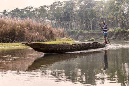Chitwan, Nepal - October 21, 2018: Riverboat used to ride tourists on the river in Chitwan National Park, Nepal.のeditorial素材