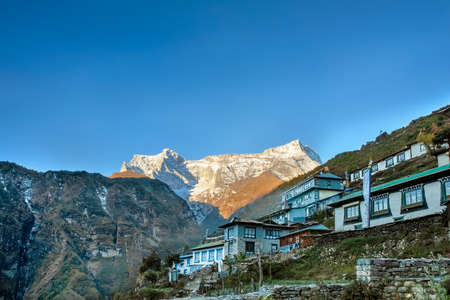 View at the Sunrise over houses and surrounding mountains in Namche Bazaar, Nepalのeditorial素材