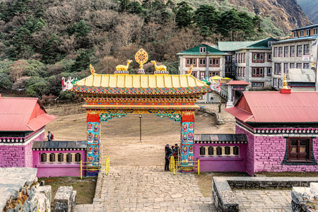 Tengboche, Nepal - October 28, 2018: Tourists at the entrance gate to monastery in Tengboche, Nepal